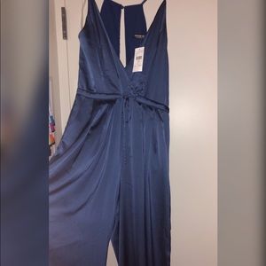 Brand New jump suit size L with pockets